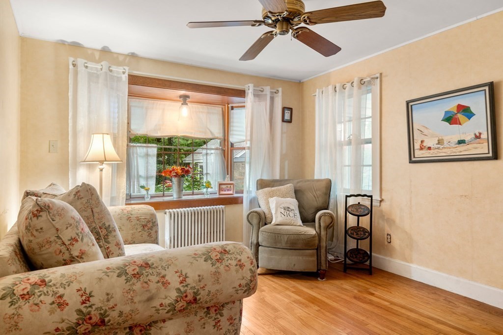 17 Centre Lane Milton, MA 02186 - Photo 11 of 26 a living room with furniture and a large window