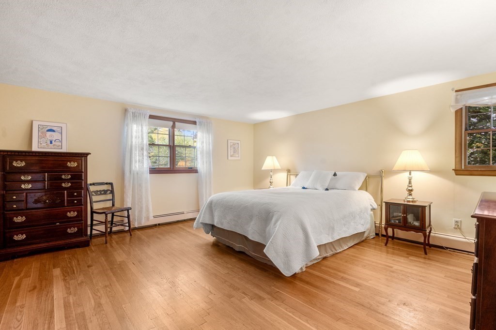 17 Centre Lane Milton, MA 02186 - Photo 13 of 26 a bedroom with a bed and a tv