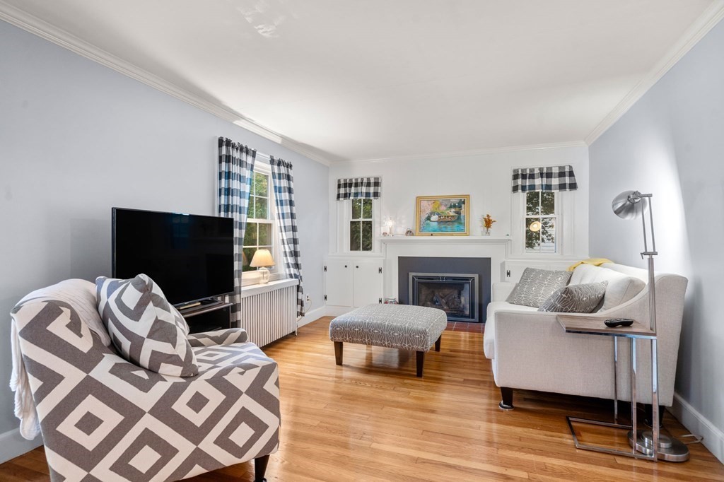 17 Centre Lane Milton, MA 02186 - Photo 2 of 26 a living room with furniture and a flat screen tv