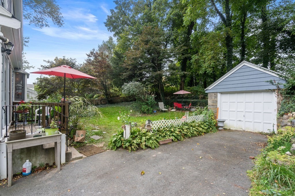 17 Centre Lane Milton, MA 02186 - Photo 22 of 26 a front view of a house with garden