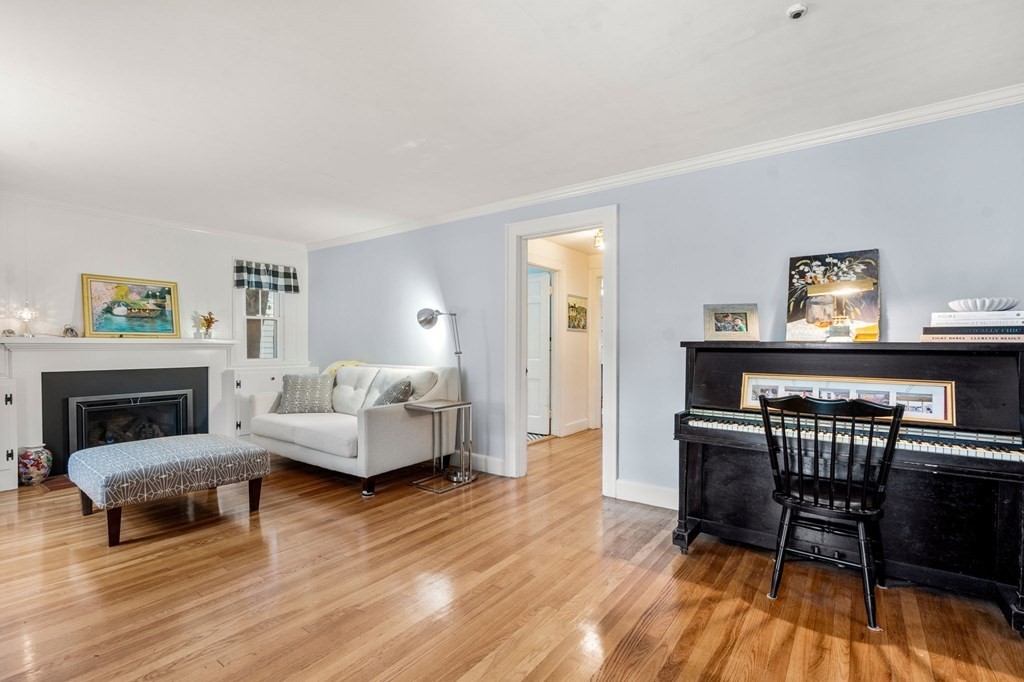 17 Centre Lane Milton, MA 02186 - Photo 3 of 26 a living room with furniture and a fireplace