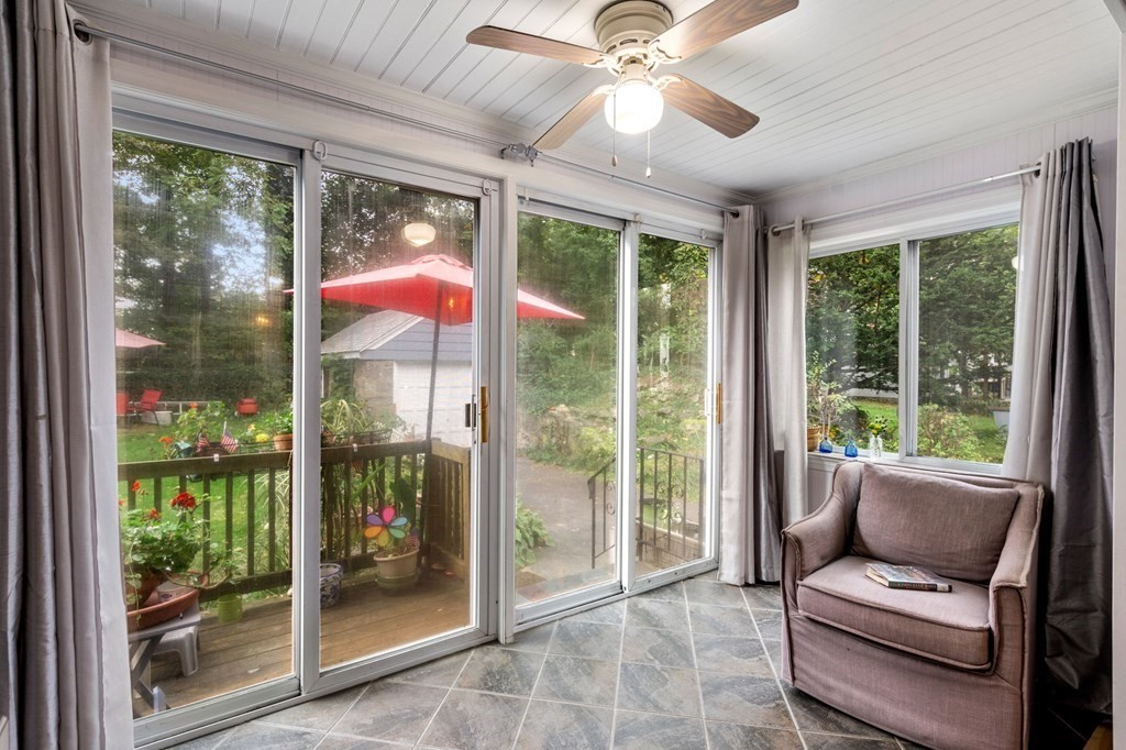 17 Centre Lane Milton, MA 02186 - Photo 9 of 26 a living room with furniture and a floor to ceiling window