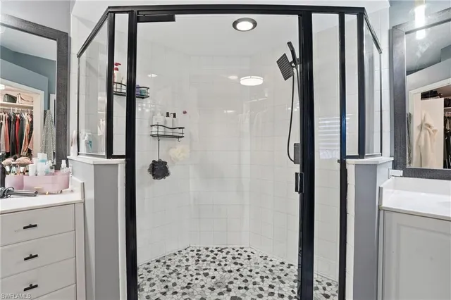 a bathroom with a shower and a sink
