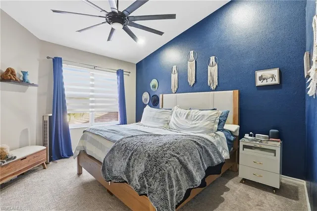 a bed room with a bed and a window