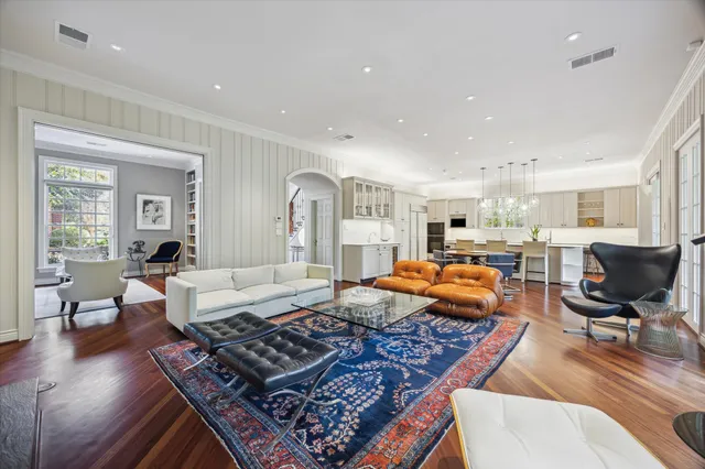 a bathroom with a double vanity sink mirror and bathtub