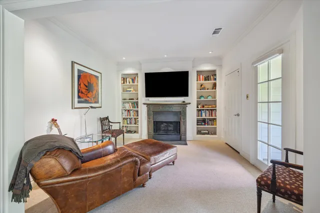 a view of a kitchen with white cabinets and a sink