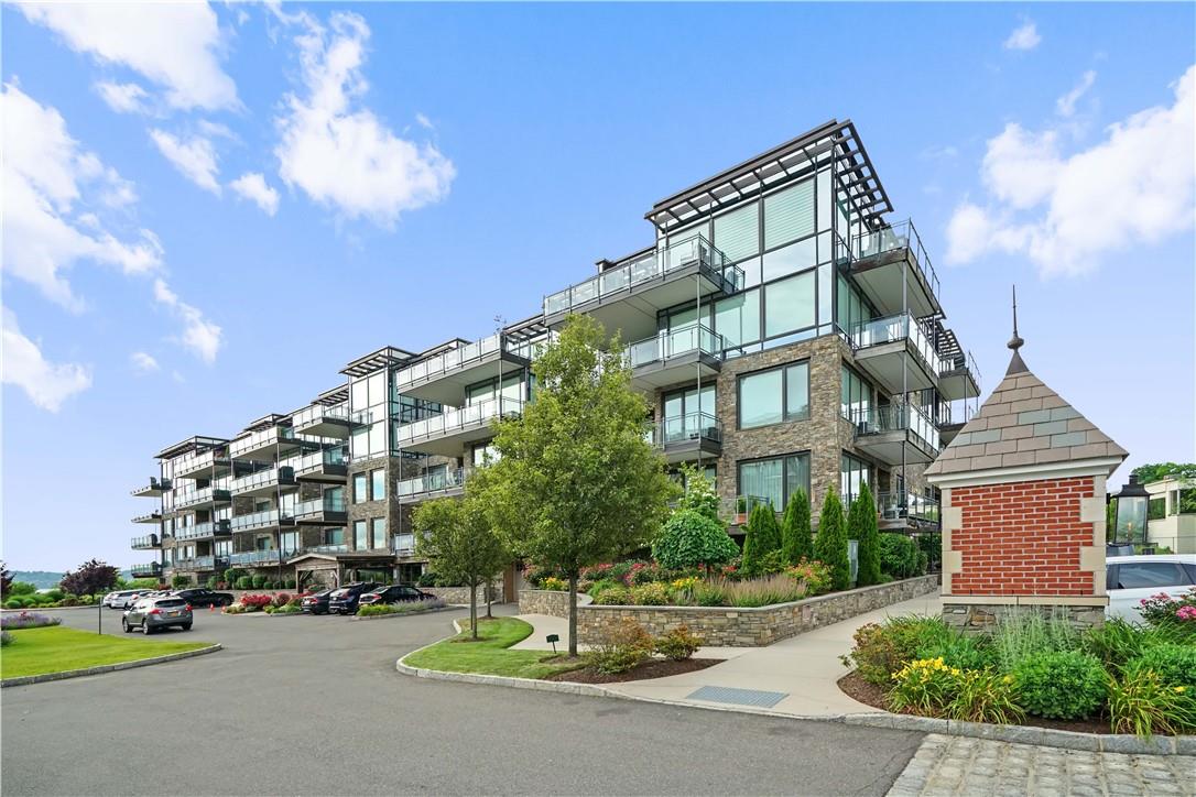 18 Rivers Edge Drive, Unit 403 Tarrytown, NY 10591 - Photo 1 of 1 a front view of a building