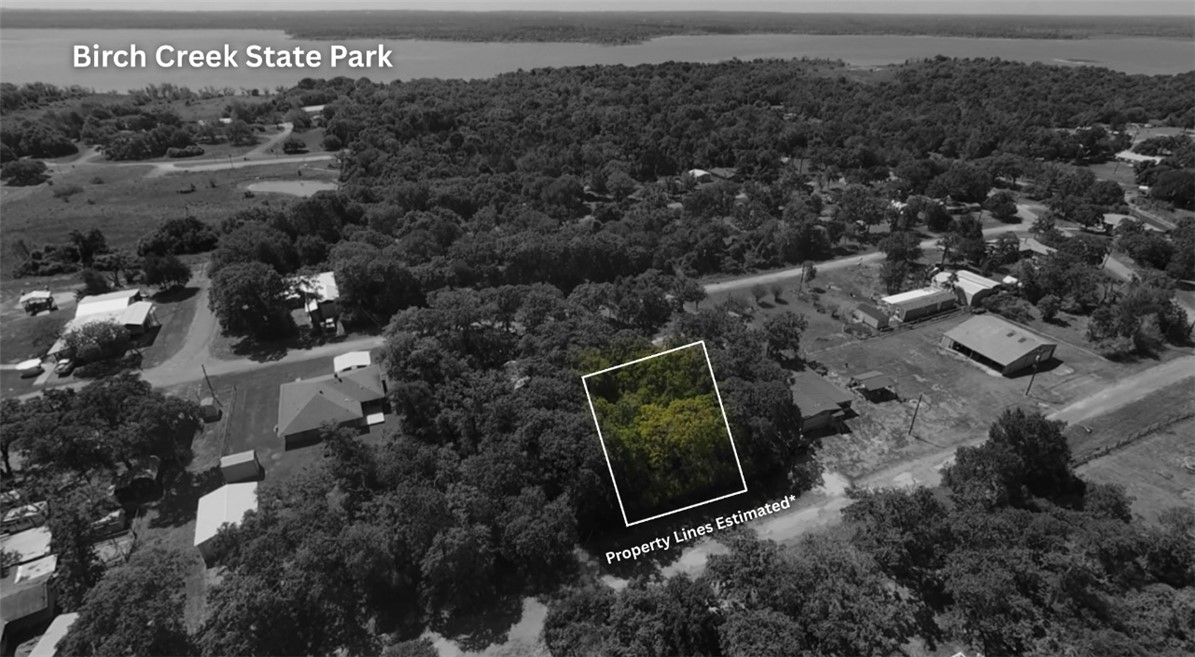 107 Live Oak Lane, Unit A Somerville, TX 77879 - Photo 5 of 5 an aerial view of house with yard and mountain view in back