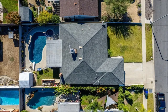 an aerial view of houses with outdoor space