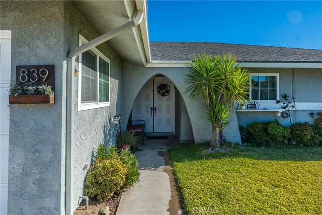 a front view of a house with garden