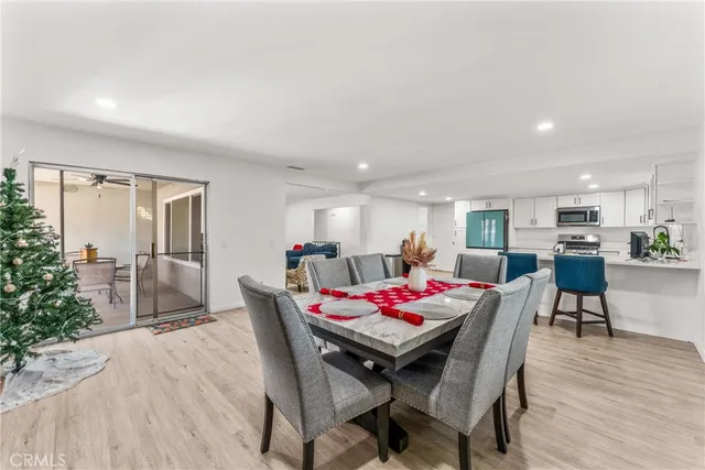a dining room with furniture and wooden floor