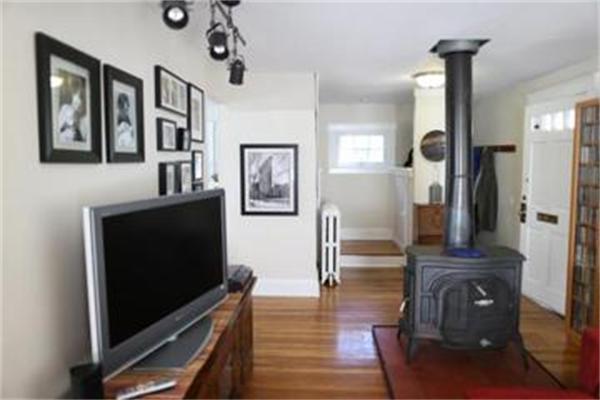 26 Barrington Road Boston, MA 02124 - Photo 2 of 10 a living room with furniture and a flat screen tv