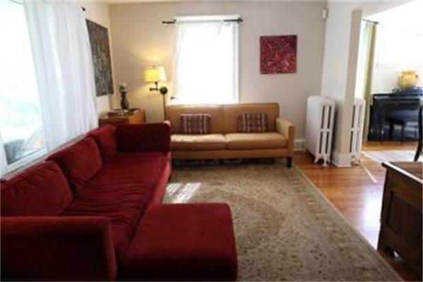 26 Barrington Road Boston, MA 02124 - Photo 6 of 10 a living room with furniture a flat screen tv and a window