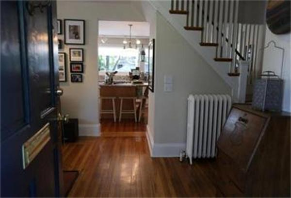 26 Barrington Road Boston, MA 02124 - Photo 7 of 10 a room with wooden floor and stairs