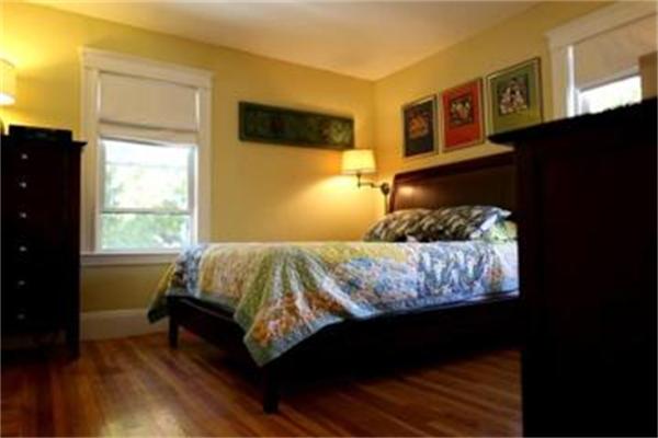 26 Barrington Road Boston, MA 02124 - Photo 10 of 10 a bedroom with a bed and wooden floor