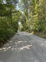 183 South E Main Street Douglas, MA 01516 - Photo 9 of 10 a view of dirt field with trees in background