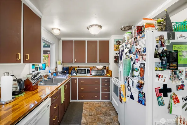 a view of a kitchen with a sink and a microwave