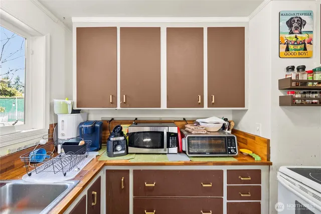 a kitchen with a sink and a stove