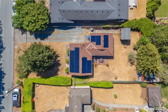 an aerial view of a house with yard