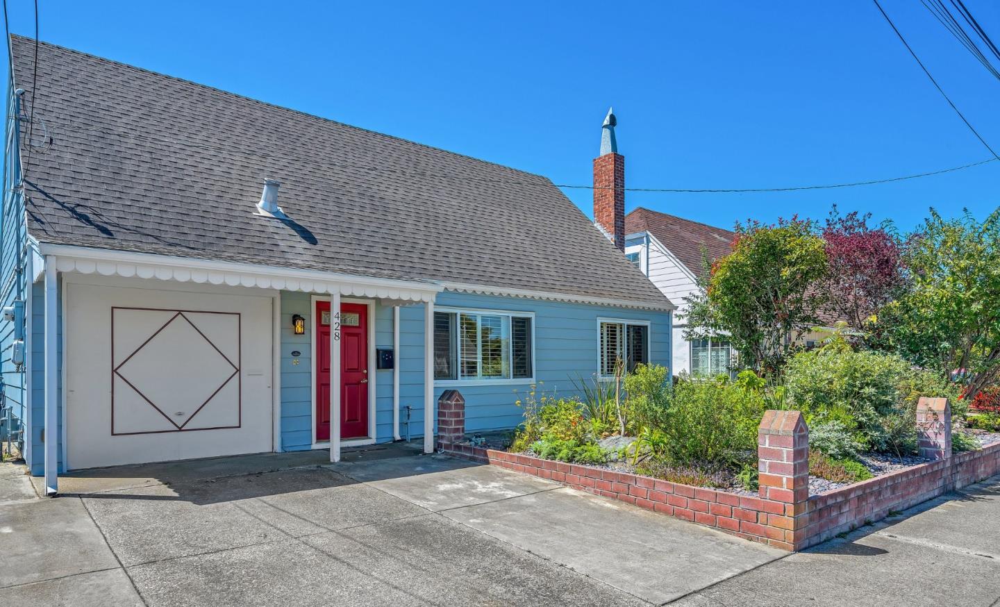 428 Glasgow Drive Pacifica, CA 94044 - Photo 2 of 13 a front view of a house with garden