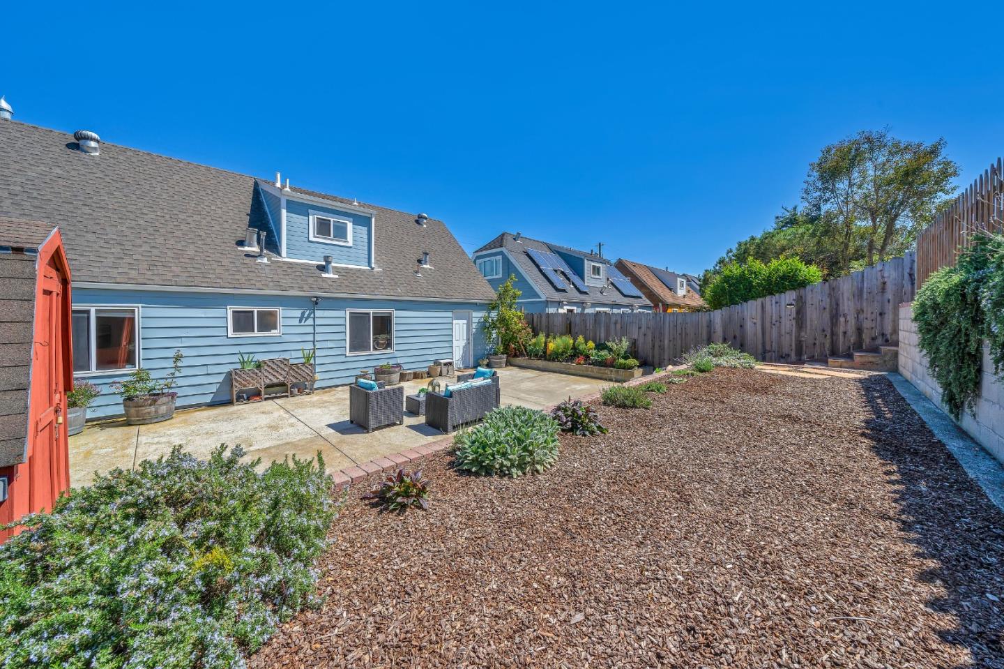 428 Glasgow Drive Pacifica, CA 94044 - Photo 10 of 13 a view of a house with backyard and a garden