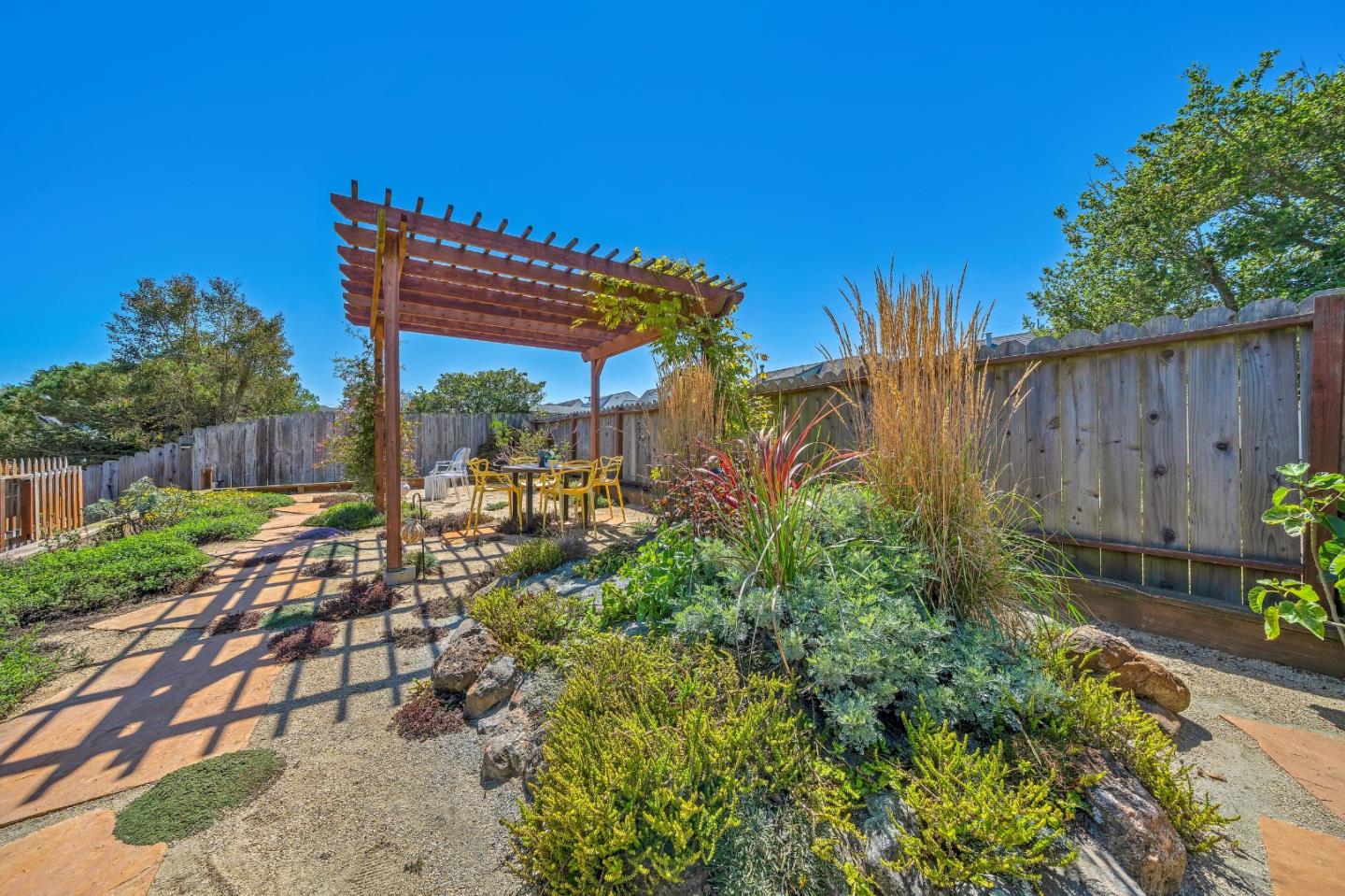 428 Glasgow Drive Pacifica, CA 94044 - Photo 6 of 13 a view of a chair and table in the garden