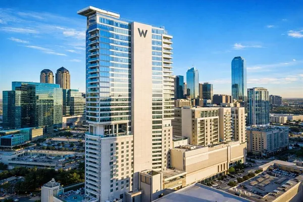 a view of buildings with glass windows