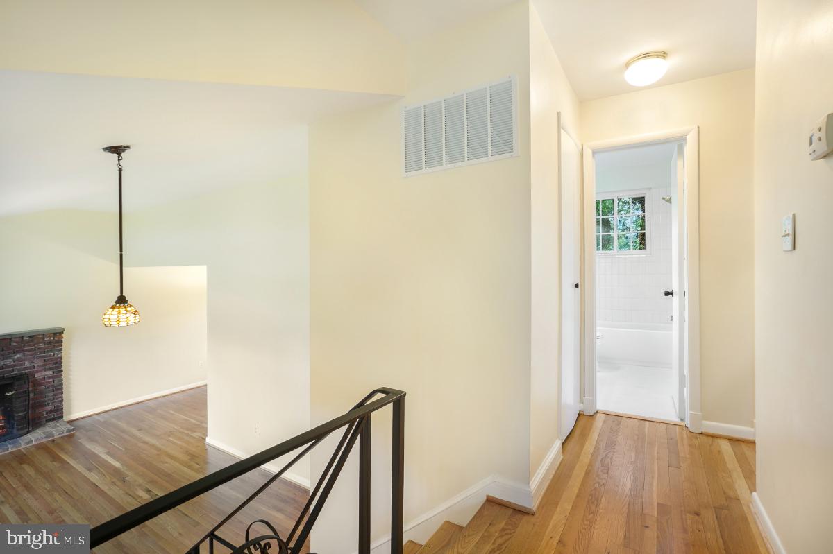 804 Gregorio Drive Silver Spring, MD 20901 - Photo 16 of 33 a view of a hallway with wooden floor