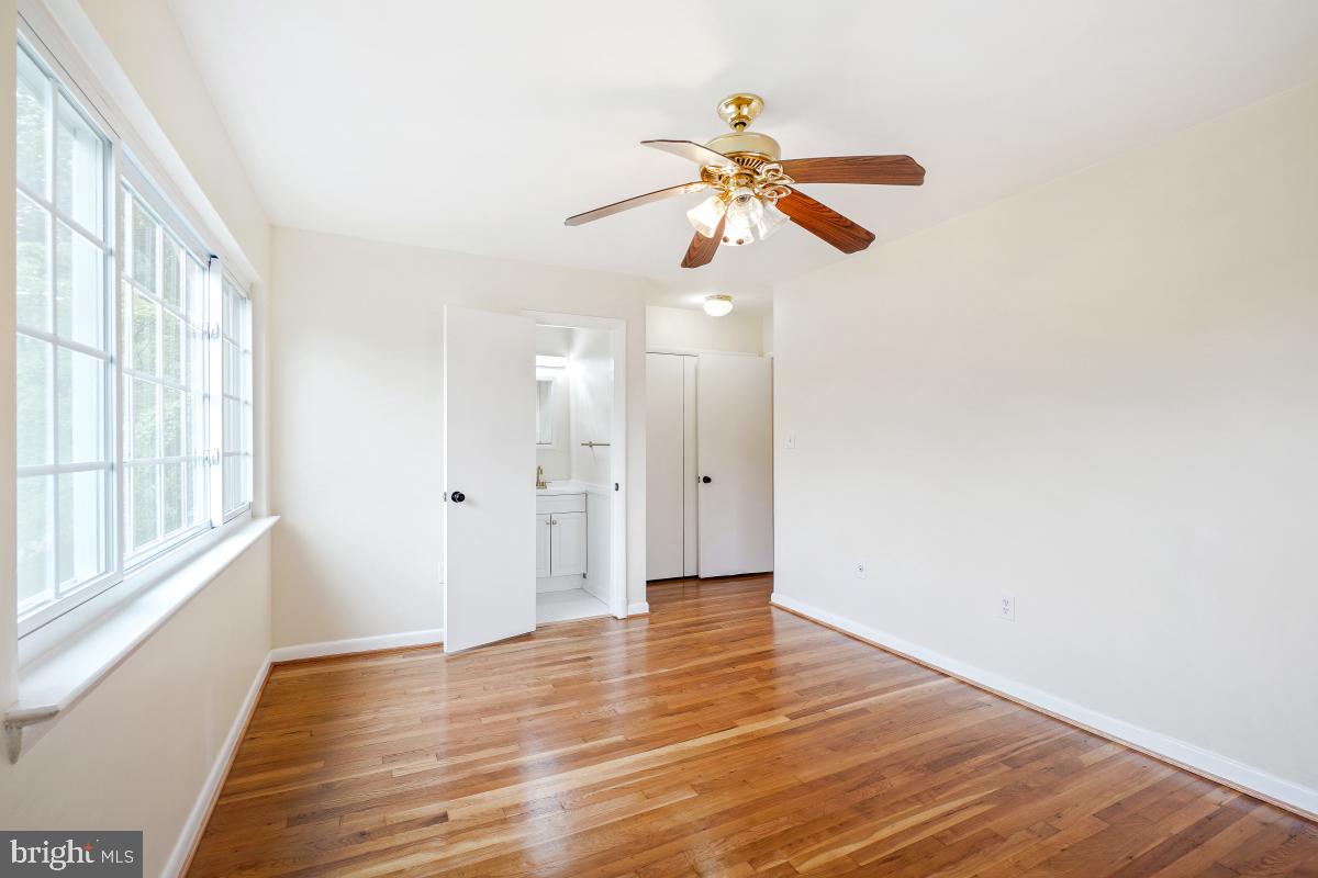 804 Gregorio Drive Silver Spring, MD 20901 - Photo 19 of 33 a view of an empty room with wooden floor and window