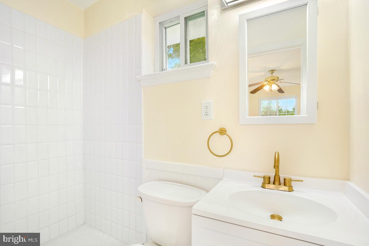 804 Gregorio Drive Silver Spring, MD 20901 - Photo 20 of 33 a bathroom with a sink and a mirror