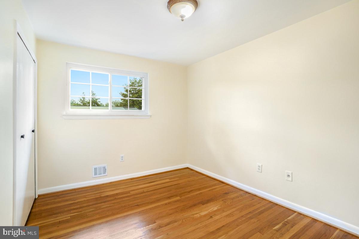 804 Gregorio Drive Silver Spring, MD 20901 - Photo 21 of 33 a view of a room with wooden floor and window