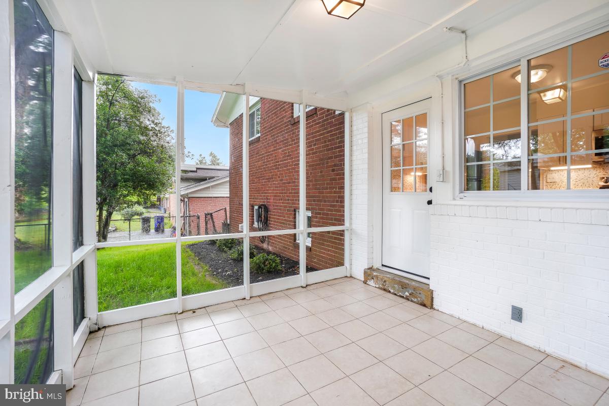 804 Gregorio Drive Silver Spring, MD 20901 - Photo 28 of 33 a view of a house with a backyard and a balcony