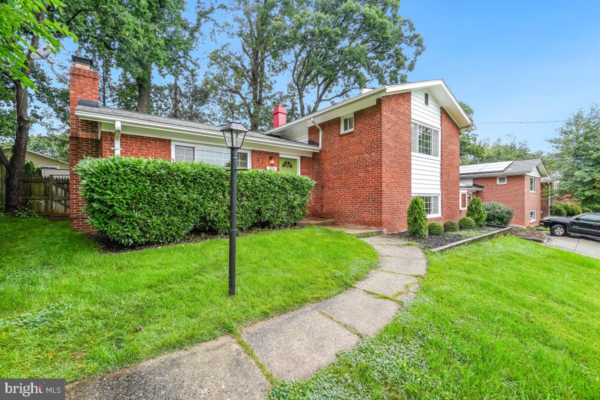 804 Gregorio Drive Silver Spring, MD 20901 - Photo 4 of 33 a front view of a house with a yard