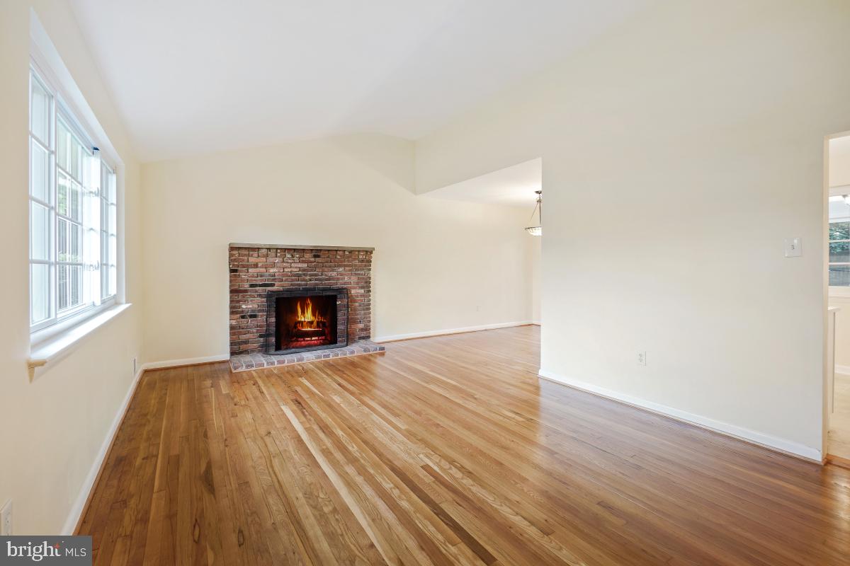 804 Gregorio Drive Silver Spring, MD 20901 - Photo 6 of 33 a view of an empty room with wooden floor and a window