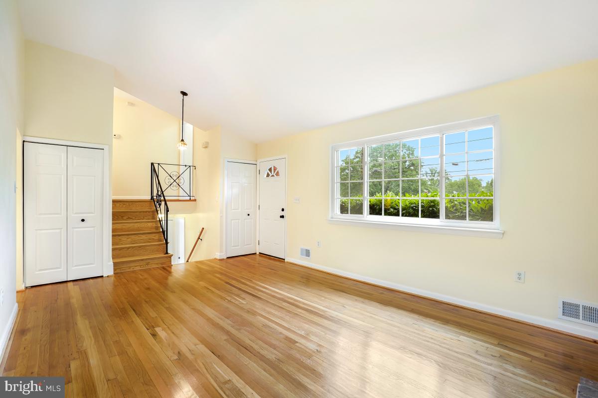 804 Gregorio Drive Silver Spring, MD 20901 - Photo 8 of 33 a view of empty room with wooden floor and fan