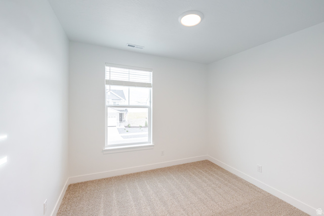 693 West 4500th South, Unit O202 Mapleton, UT 84664 - Photo 5 of 16 Spare room featuring light carpet and baseboards