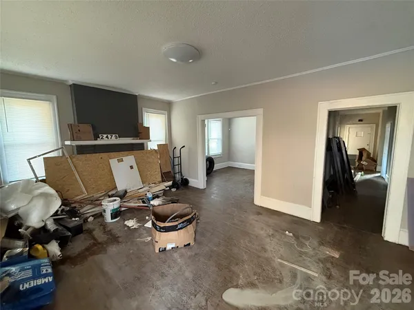 a living room with a fireplace furniture and a large window