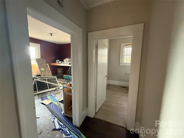 a view of a livingroom with furniture window and wooden floor