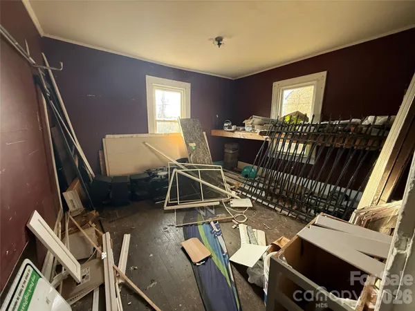 a bathroom with a sink toilet and window