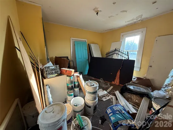 a view of a livingroom with furniture and a window