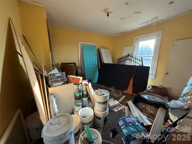 a view of a livingroom with furniture and a window