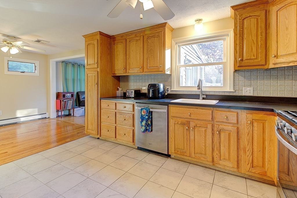 10 Stanford Road Franklin, MA 02038 - Photo 11 of 27 a kitchen with stainless steel appliances granite countertop a sink and cabinets