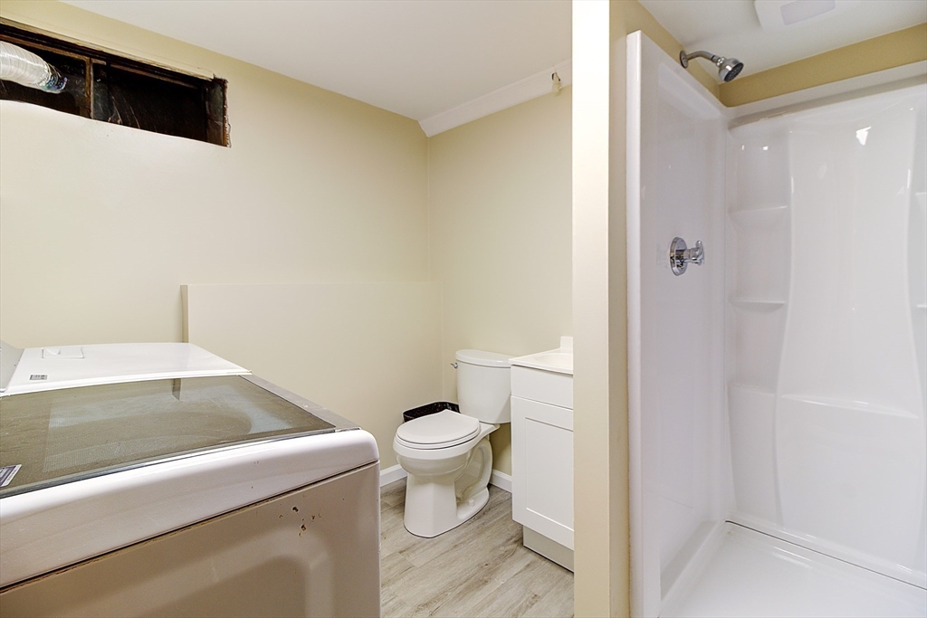 10 Stanford Road Franklin, MA 02038 - Photo 19 of 27 a bathroom with a sink and a toilet