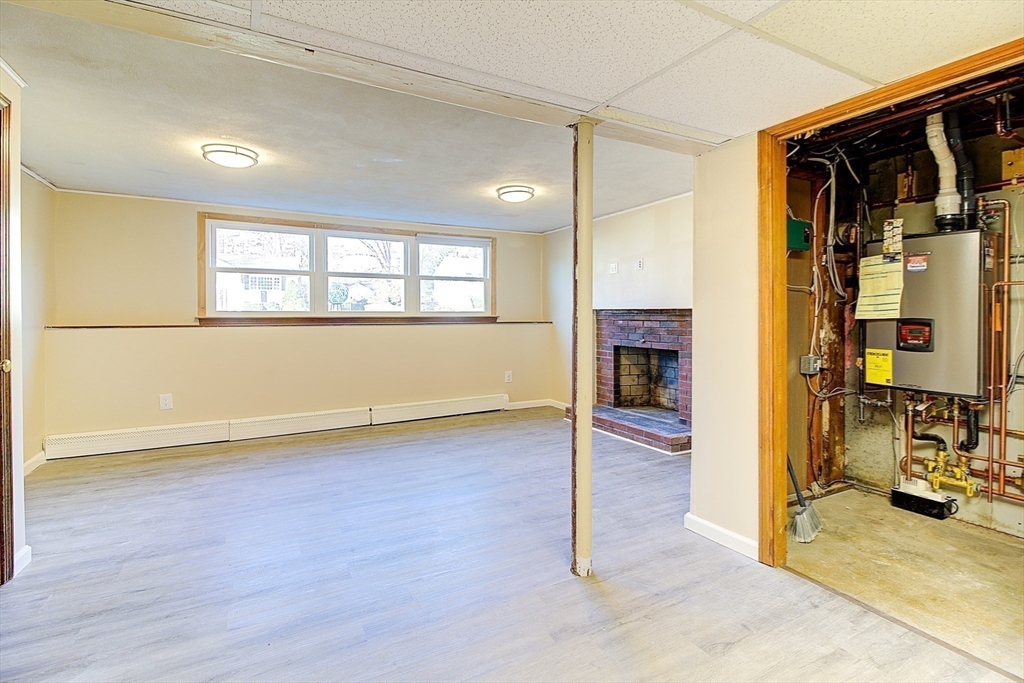 10 Stanford Road Franklin, MA 02038 - Photo 23 of 27 an empty room with wooden floor and windows