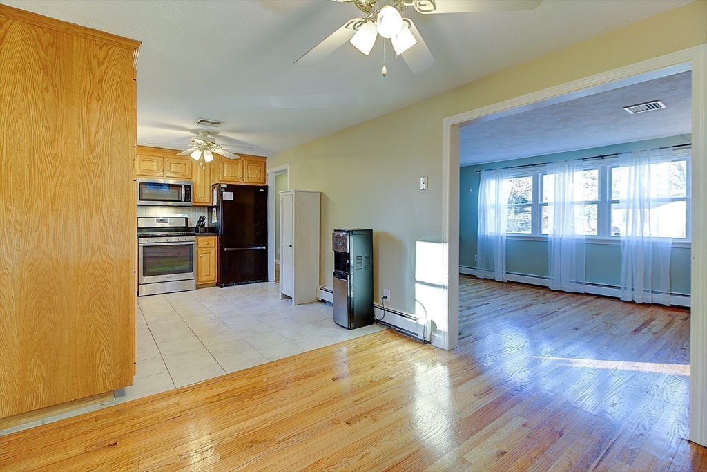 10 Stanford Road Franklin, MA 02038 - Photo 9 of 27 a view of a kitchen with a sink and a refrigerator