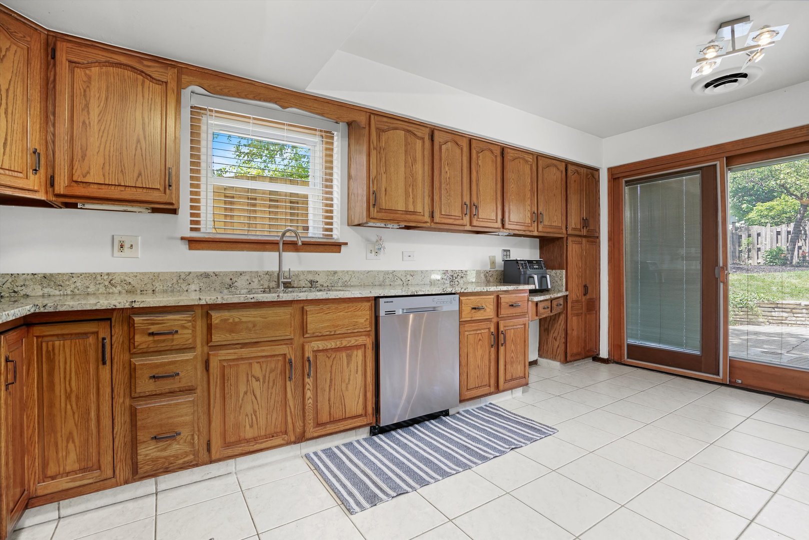 2130 Birch Street Park Ridge, IL 60068 - Photo 17 of 47 a kitchen with stainless steel appliances granite countertop a stove a sink and a refrigerator