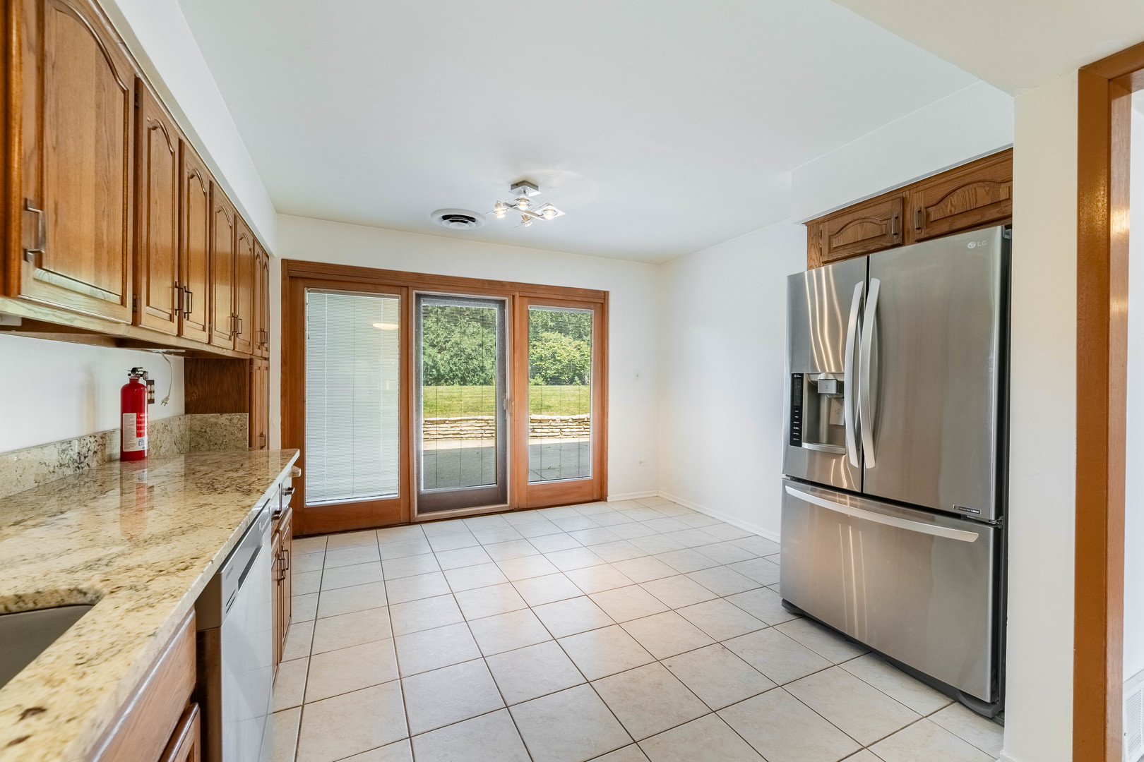 2130 Birch Street Park Ridge, IL 60068 - Photo 22 of 47 a kitchen with stainless steel appliances granite countertop a refrigerator and a sink