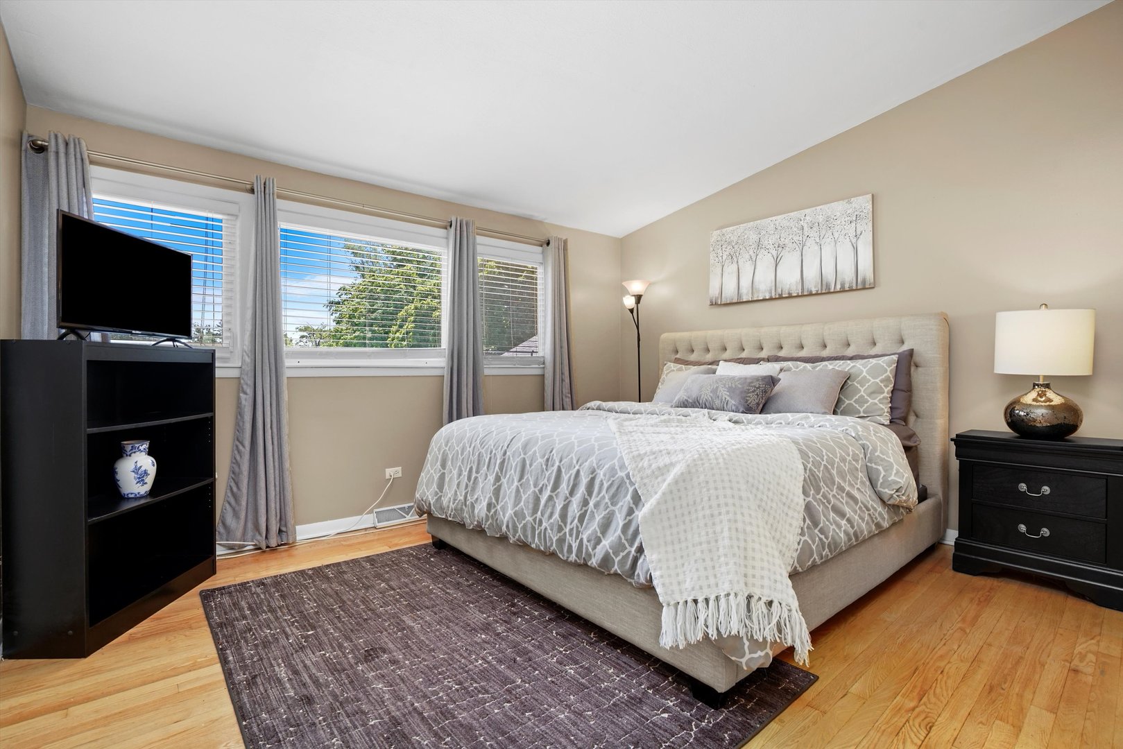 2130 Birch Street Park Ridge, IL 60068 - Photo 23 of 47 a bed room with a bed and a television