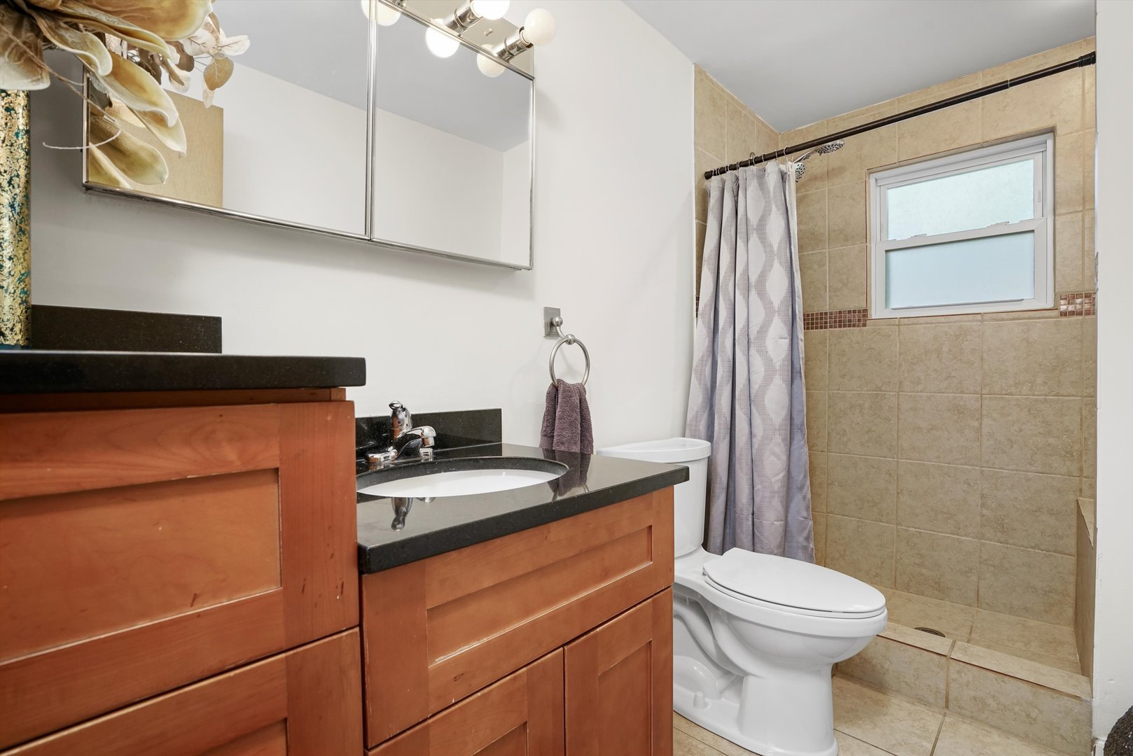 2130 Birch Street Park Ridge, IL 60068 - Photo 27 of 47 a bathroom with a granite countertop sink toilet and shower