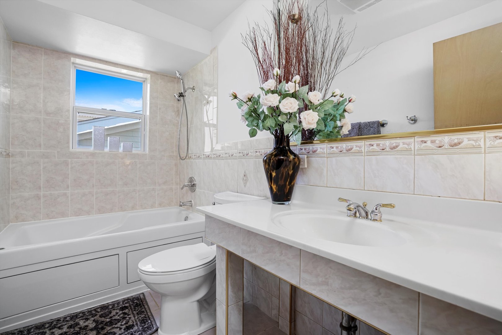 2130 Birch Street Park Ridge, IL 60068 - Photo 30 of 47 a bathroom with a sink a toilet and a bathtub
